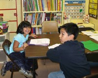 Building vocabulary and modeling correct sentence structure through scripted dialogue.